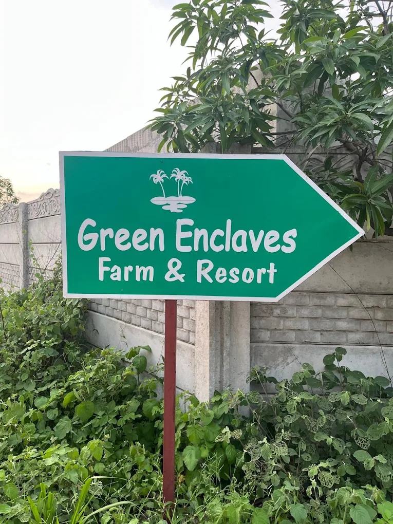 Official Green Enclaves Farm & Resort entrance directional signboard